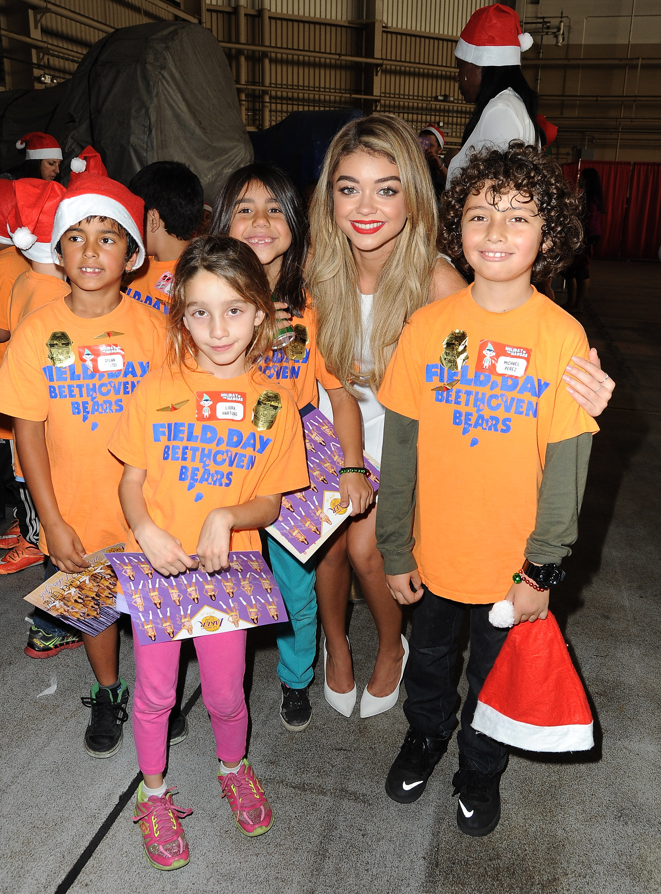 Sarah Hyland & Jordin Sparks Celebrate the Holidays at Delta Airlines’ “Holiday in the Hangar” at LAX