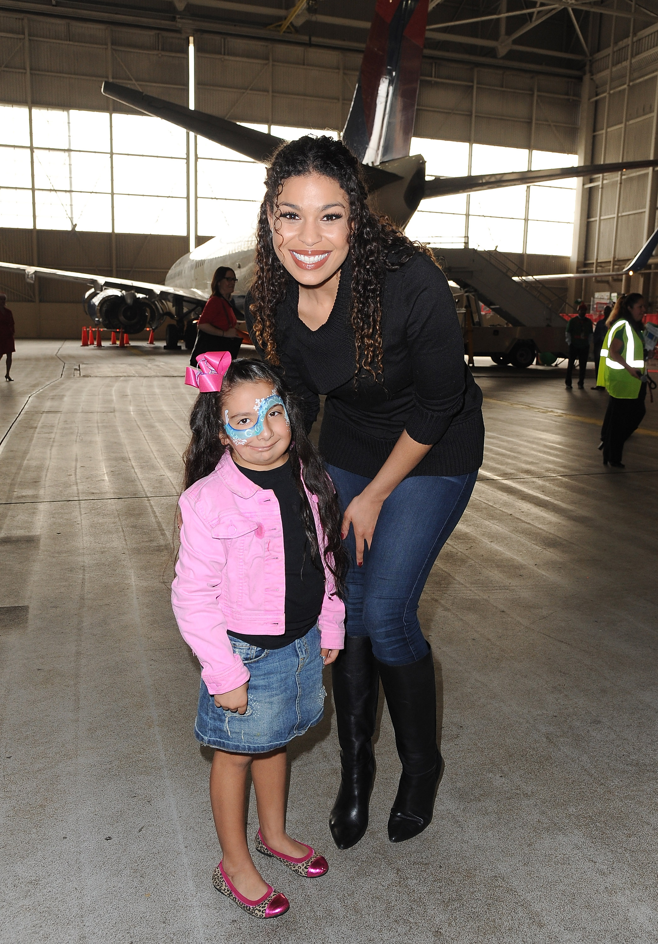 Sarah Hyland & Jordin Sparks Celebrate the Holidays at Delta Airlines’ “Holiday in the Hangar” at LAX