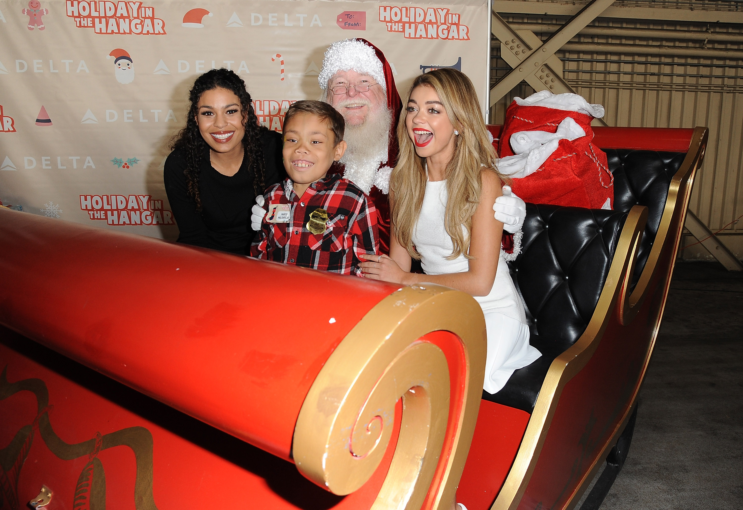 Sarah Hyland & Jordin Sparks Celebrate the Holidays at Delta Airlines’ “Holiday in the Hangar” at LAX