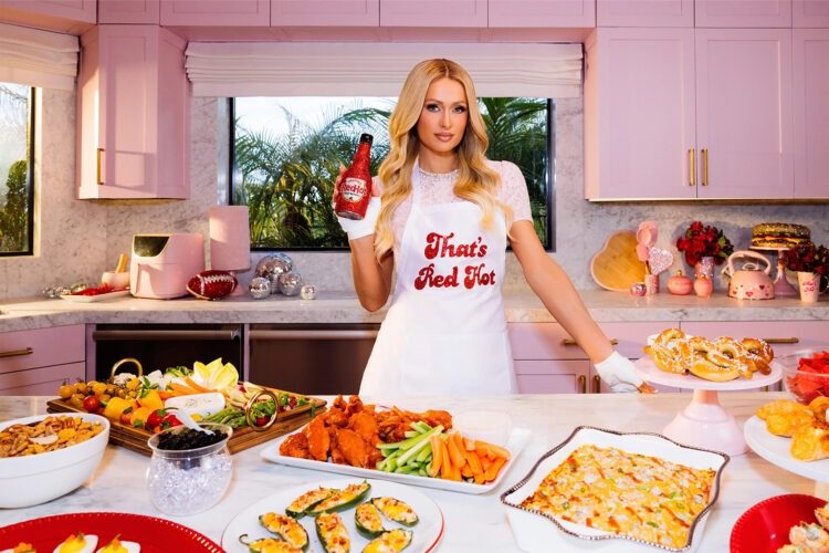 Paris Hilton Serves Up Spicy Game Day Glam in New Frank’s RedHot Super Bowl Ad
