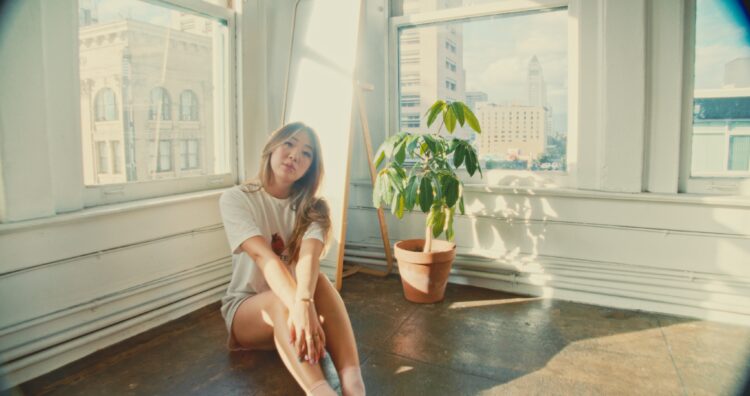 Simona Shao Takes Us Behind the Scenes of Her “Waves” Music Video: From Rainy Chaos to Beachfront Magic (Exclusive)