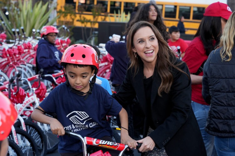 Lacey Chabert and Todd Graves Turn Christmas Spirit Into Real-Life Magic at Raising Cane’s Annual Holiday Bike Giveaway (Recap)